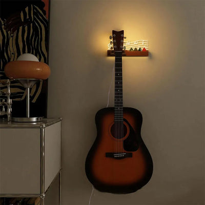 Support Mural Guitare Bois LED avec guitare posée dessus
